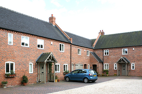 Reconfiguration of Hardinge Arms pub and new houses to the rear in Kings Newton conservation area, Derbyshire designed by Darren Mayner