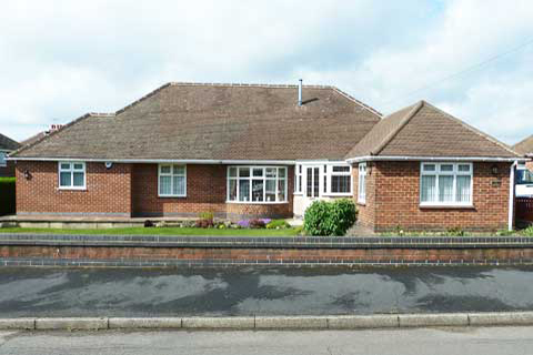 Large extension to bungalow in Riddings, Alfreton, Derbyshire to provide living, sleeping and bathing facilities for wheelchair user designed by Darren Mayner